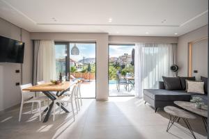 A television and/or entertainment centre at Aida Luxury Villas