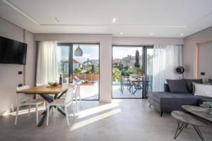 A television and/or entertainment centre at Aida Luxury Villas