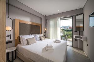 A bed or beds in a room at Aida Luxury Villas