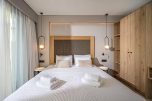 A bed or beds in a room at Aida Luxury Villas