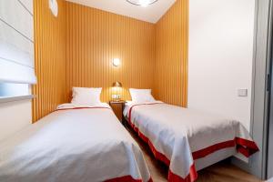 Postel nebo postele na pokoji v ubytování Hotel Gothards
