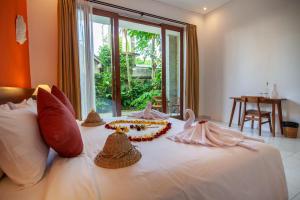 Postel nebo postele na pokoji v ubytování Ahamta Ubud by Prasi + 37 fotografií