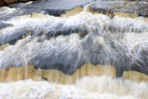 a close up of water on a waterfall at The Old School House in Bainbridge