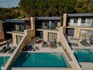 an aerial view of a house with a swimming pool at Villa Scorpio in Paleros