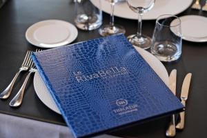 a blue napkin sitting on top of a table at Thalazur Ouistreham - Hôtel & Spa in Ouistreham