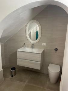 a bathroom with a sink and a mirror at Zohra in Castellammare del Golfo