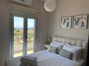 En eller flere senger på et rom på Villa Proistakis