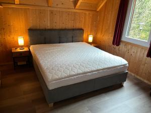 A bed or beds in a room at Alpenferienhaus Sophia