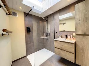 a bathroom with a shower and a sink at STKE - holiday home for 8 in Veurne