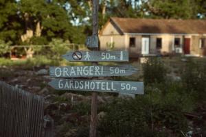 a street sign in front of a house at Ödevata Gårdshotell in Emmaboda