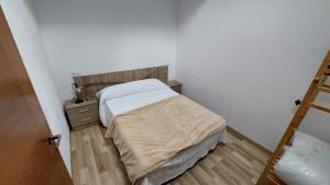 Postel nebo postele na pokoji v ubytování Casa vacacional de pueblo