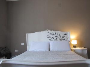 A bed or beds in a room at Il Rifugio dei Briganti