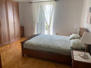Posteľ alebo postele v izbe v ubytovaní Kate Apartment