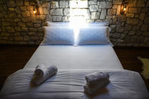 Katil atau katil-katil dalam bilik di Anhel Hotel