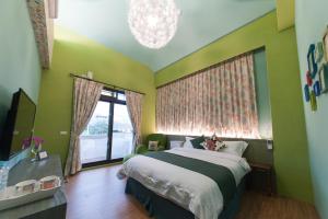 Postel nebo postele na pokoji v ubytování 心享庭園民宿 Wishes B&B