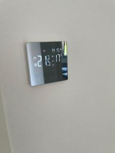 a clock on a wall with a clock on it at Gästehaus Miri in Lindau