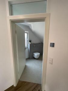 a bathroom with a toilet in a room at Gästehaus Miri in Lindau