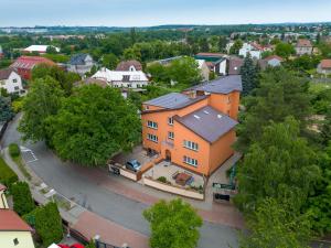 an overhead view of a large orange house in a town at Hotel Max in Prague