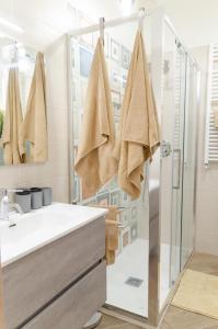 a bathroom with a shower and a sink at Don Gaetano Apartment - Nel Cuore di Napoli in Naples