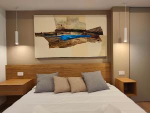 Postel nebo postele na pokoji v ubytování Carducci Art Guesthouse