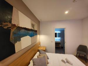 Postel nebo postele na pokoji v ubytování Carducci Art Guesthouse