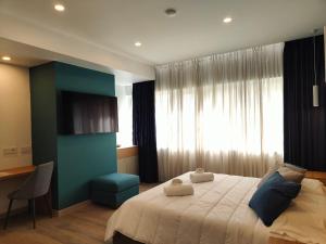 Postel nebo postele na pokoji v ubytování Carducci Art Guesthouse