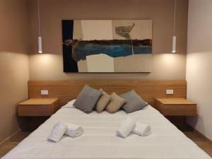 Postel nebo postele na pokoji v ubytování Carducci Art Guesthouse