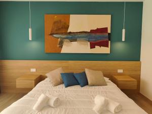 Postel nebo postele na pokoji v ubytování Carducci Art Guesthouse