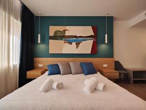 Postel nebo postele na pokoji v ubytování Carducci Art Guesthouse