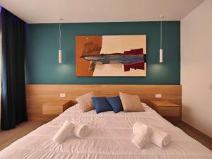 Postel nebo postele na pokoji v ubytování Carducci Art Guesthouse