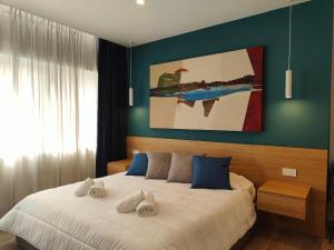 Postel nebo postele na pokoji v ubytování Carducci Art Guesthouse