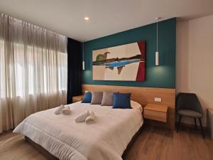Postel nebo postele na pokoji v ubytování Carducci Art Guesthouse
