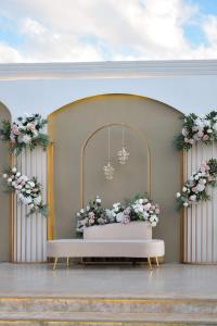 a wedding altar with flowers and a chandelier at مزرعة جوليا in Ajloun