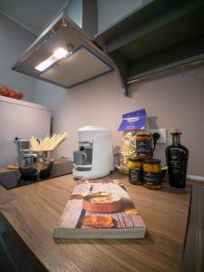 a kitchen counter with some food on a cutting board at Locanda dei Sette Limoni in Vada