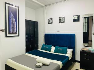 Krevet ili kreveti u jedinici u okviru objekta Hotel Bogota Home