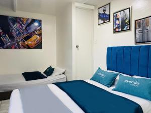 Krevet ili kreveti u jedinici u okviru objekta Hotel Bogota Home