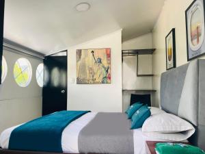 Krevet ili kreveti u jedinici u okviru objekta Hotel Bogota Home
