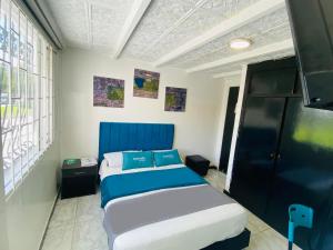 Krevet ili kreveti u jedinici u okviru objekta Hotel Bogota Home