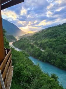 a view of a river from a porch with a view at Rafting Blue River Tara in &Scaron;ćepan-Polje