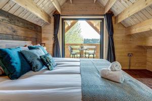 Tempat tidur dalam kamar di Buttercup Lodge