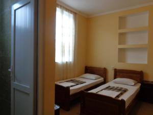 Postel nebo postele na pokoji v ubytování White Guest House