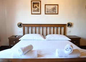 Katil atau katil-katil dalam bilik di Anhel Hotel