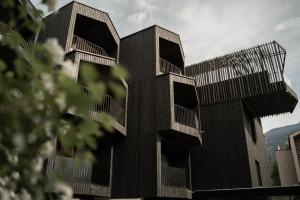 a building with balconies on the side of it at Amrai Suites in Schruns-Tschagguns