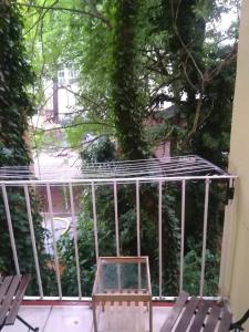 a balcony with chairs and a view of a yard at Comfy apartments in good area in Prague