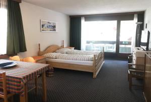 Ένα ή περισσότερα κρεβάτια σε δωμάτιο στο Aparthotel Résidence Bernerhof
