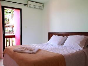 Postel nebo postele na pokoji v ubytování Pousada Porto dos Milagres