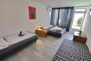 A bed or beds in a room at Penzión Šírava