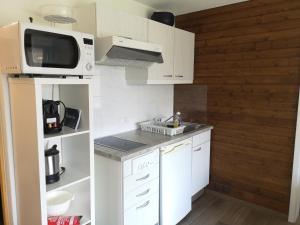 Η κουζίνα ή μικρή κουζίνα στο Aparthotel Résidence Bernerhof
