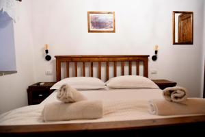 Katil atau katil-katil dalam bilik di Anhel Hotel