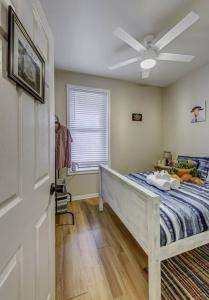 a bedroom with a bed and a ceiling fan at Good Energy Early check-in Parking Long Term More in Chicago